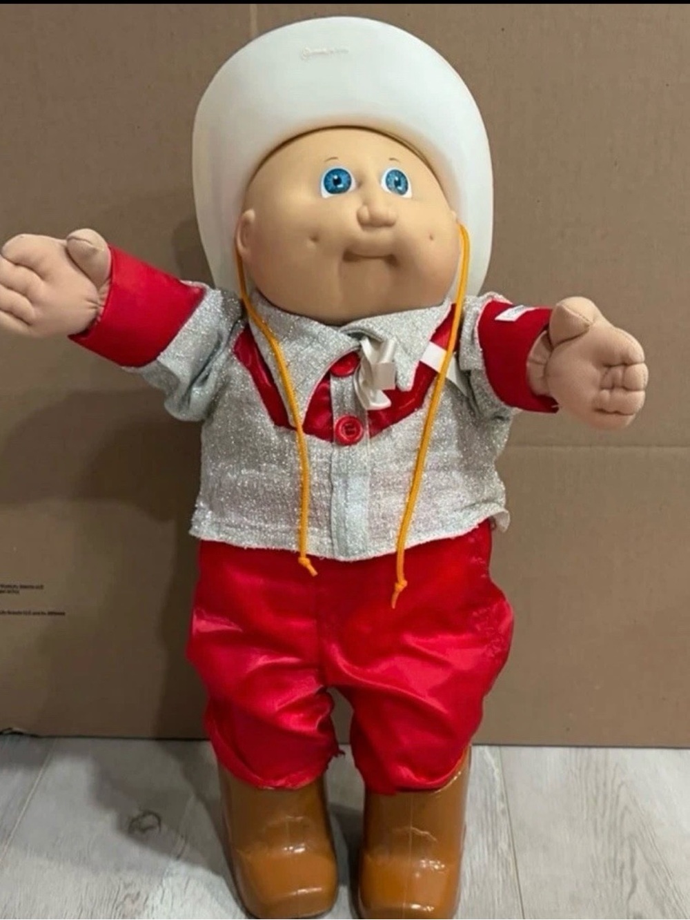 cabbage patch kids wearing a cowboy outfit with cowboy hat